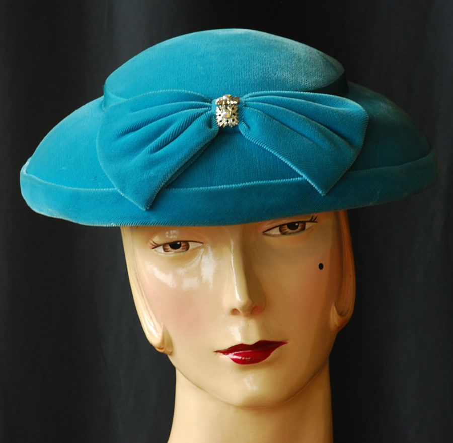 1950's blue velvet platter hat with front bow and rhinestone accent.