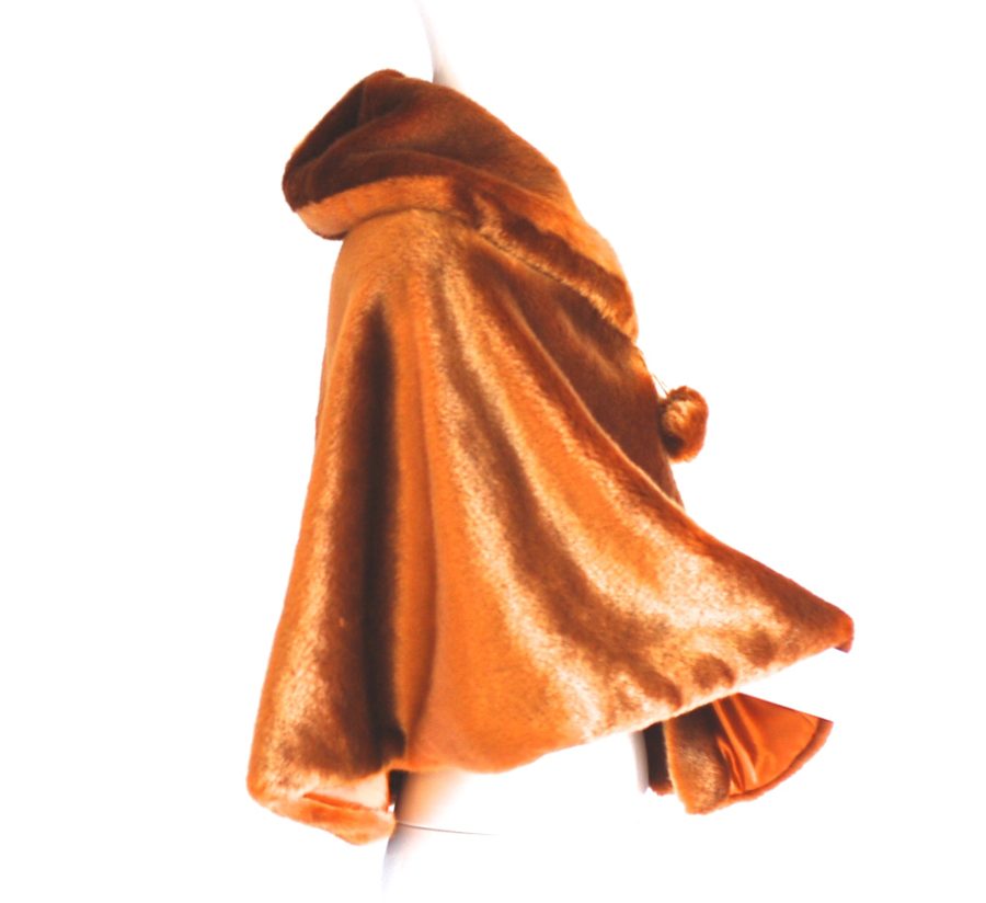 Faux fur burnt ochre cape with front tie pom pons
