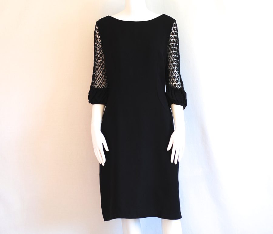 A Dress Town Original 1960's black dress with crochet sleeves. Made in Montreal, Canada