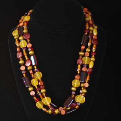 Art glass and wood bead three strand necklace with silver clasp