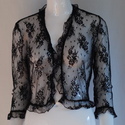Sheer black lace blouse with ruffled trim and open front