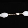 Trifari single strand lucite necklace with white and clear beads, signed