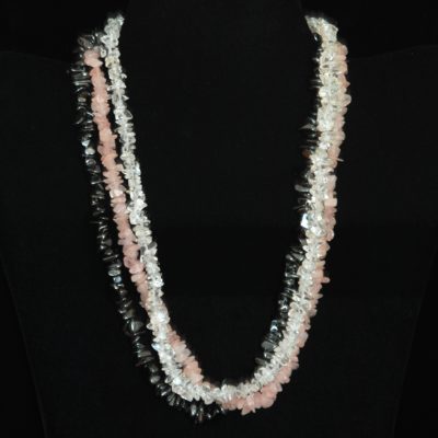 Clear and pink strands of rock crystal with a strand of hematite necklace