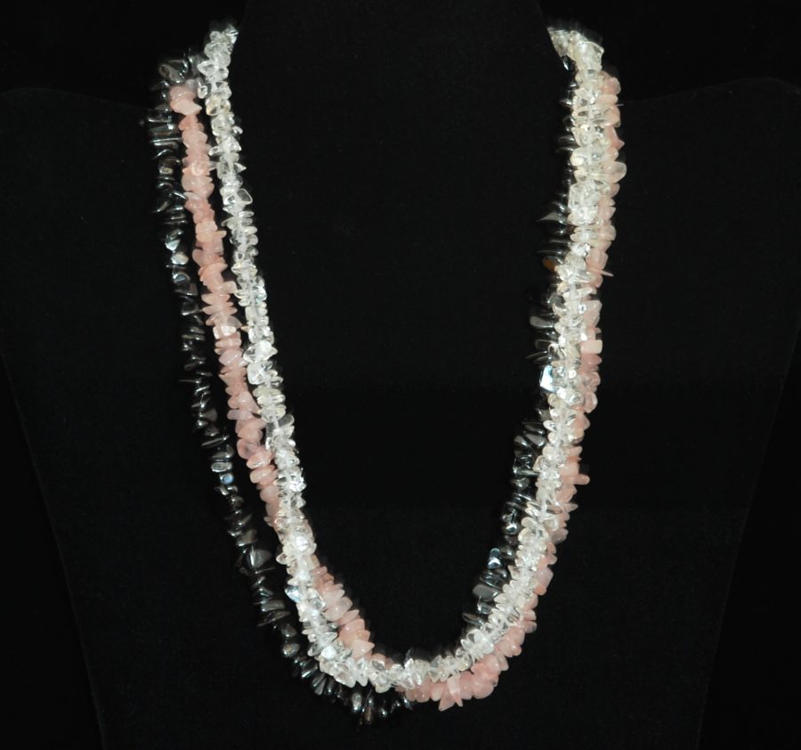 Clear and pink strands of rock crystal with a strand of hematite necklace
