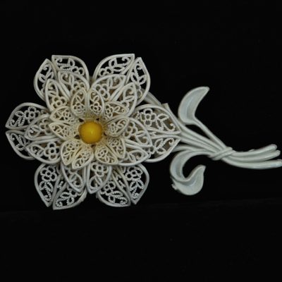 1960's white plastic flower pin with yellow centre