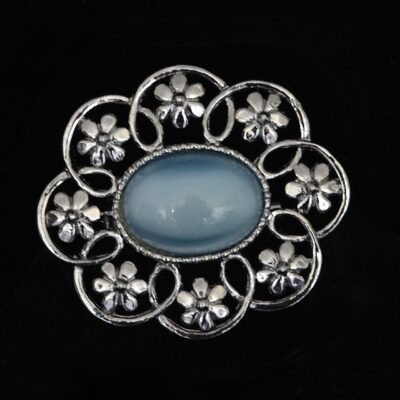 1960's Floral Themed Silver Metal Pin Featuring A Pale Azure Blue Glass Cabochon